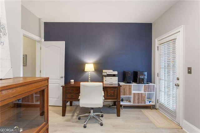 office space with light hardwood / wood-style floors