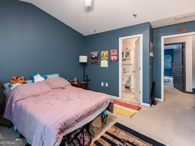 bedroom with ensuite bathroom, ceiling fan, lofted ceiling, and light colored carpet