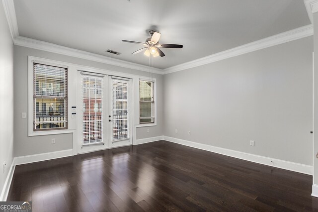 unfurnished room with ceiling fan, dark wood-type flooring, and ornamental molding