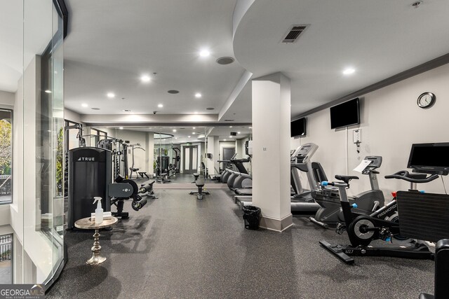 exercise room featuring ornamental molding