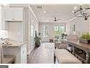 kitchen featuring white cabinets and ceiling fan