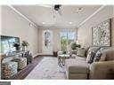 living room featuring crown molding