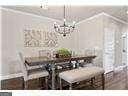 unfurnished dining area featuring a notable chandelier