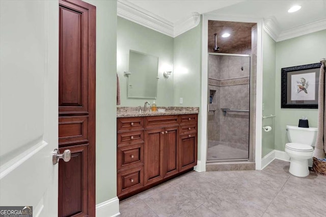 bathroom featuring crown molding, a shower with door, vanity, and toilet