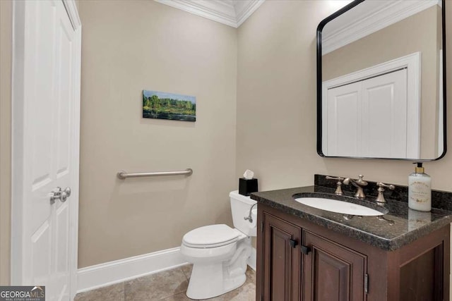 bathroom featuring tile patterned floors, crown molding, vanity, and toilet