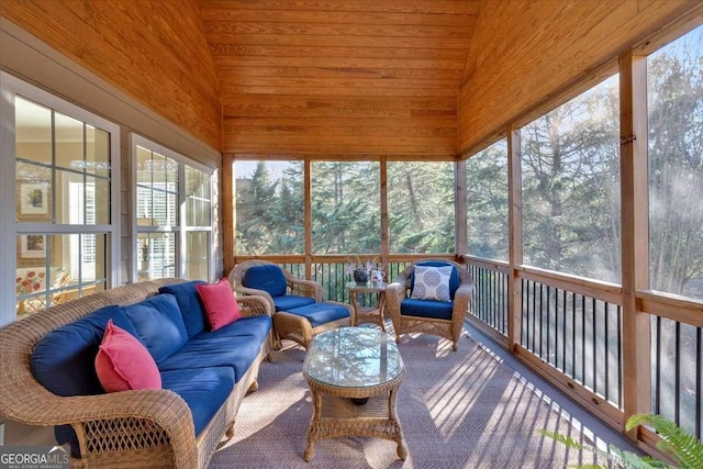 sunroom / solarium featuring lofted ceiling