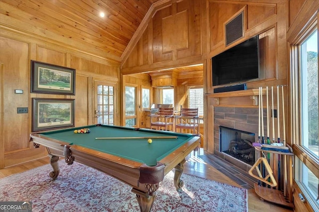 rec room featuring a tile fireplace, vaulted ceiling, pool table, wood-type flooring, and wood ceiling