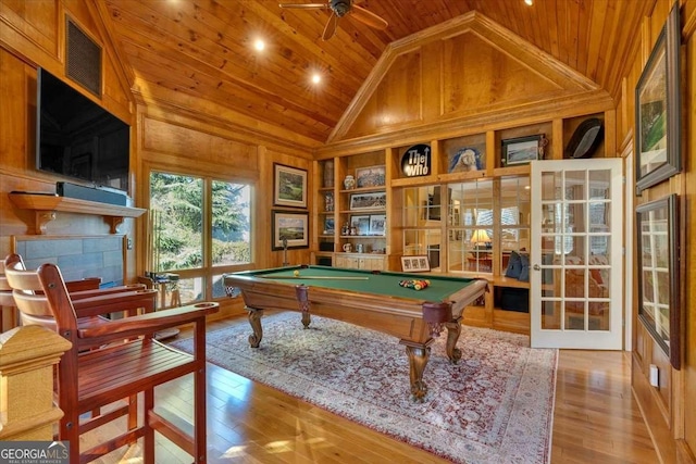 rec room with wood-type flooring, high vaulted ceiling, wooden ceiling, billiards, and wood walls