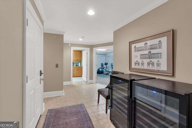 corridor featuring light tile patterned floors, beverage cooler, and ornamental molding