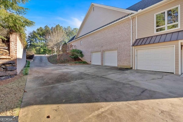 view of side of home with a garage