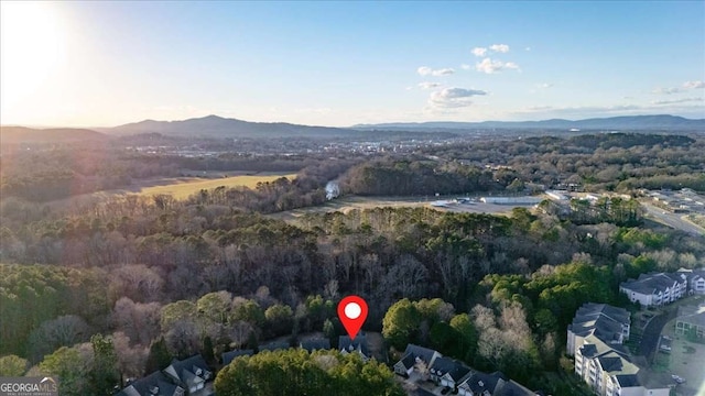 birds eye view of property featuring a mountain view