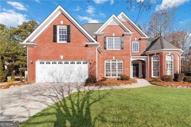 front of property with a garage and a front yard