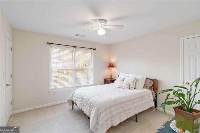 carpeted bedroom with ceiling fan