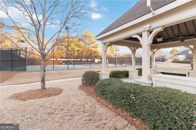 exterior space with tennis court