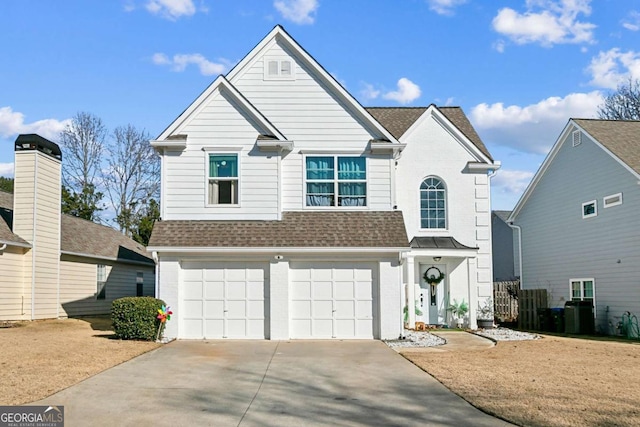 front facade with a garage