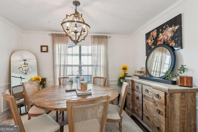 dining area with a notable chandelier and crown molding