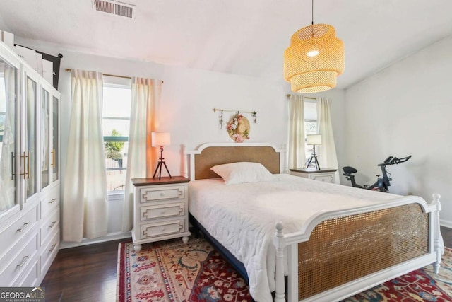 bedroom featuring dark wood-type flooring