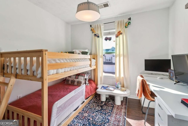 bedroom featuring dark wood-type flooring