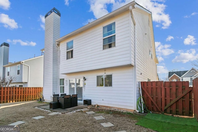 rear view of property with a patio area