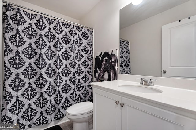 bathroom with vanity and toilet