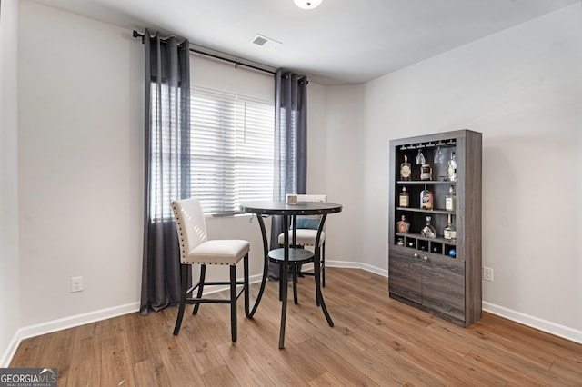 dining area with light hardwood / wood-style flooring