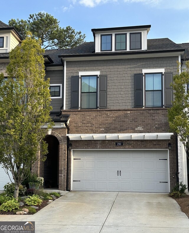 view of front of property featuring a garage