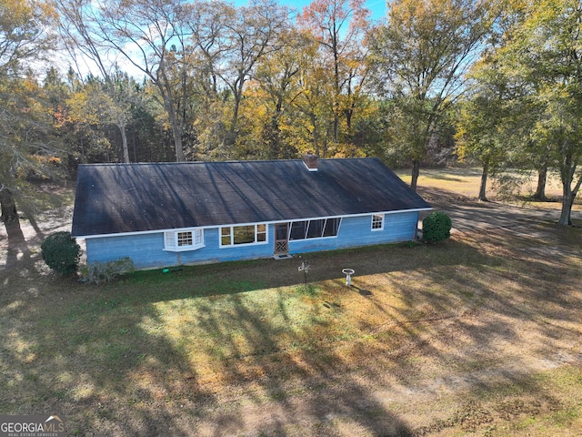 exterior space with a yard