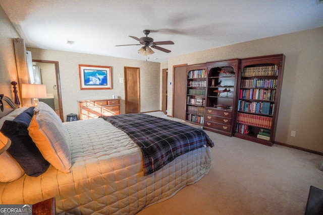 bedroom with ceiling fan and carpet floors