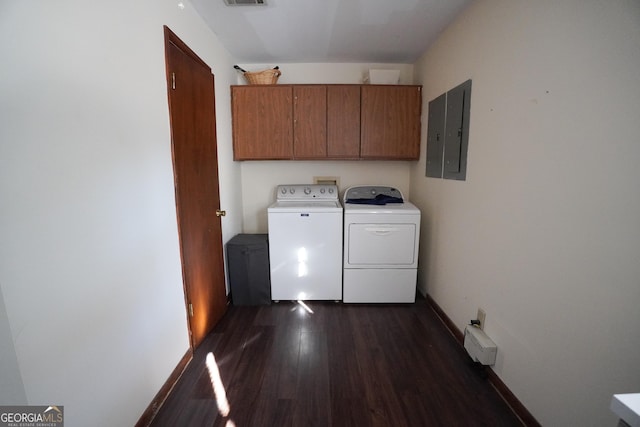 laundry area with cabinets, dark hardwood / wood-style flooring, electric panel, and washer and dryer