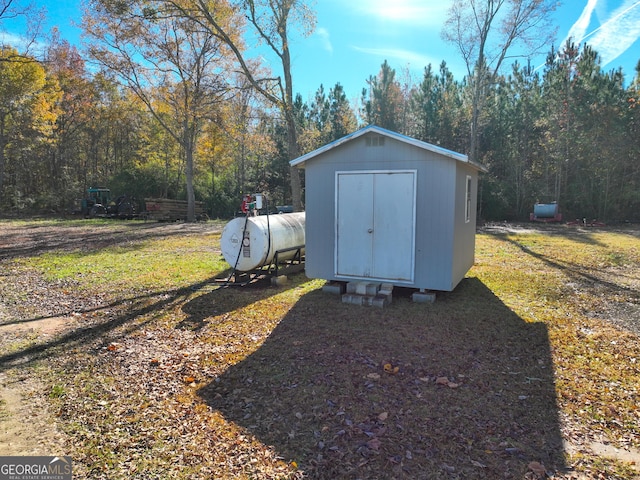 view of outbuilding with a lawn