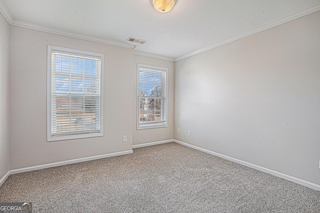 unfurnished room with visible vents, baseboards, carpet flooring, and crown molding