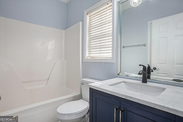 bathroom featuring toilet,  shower combination, and vanity