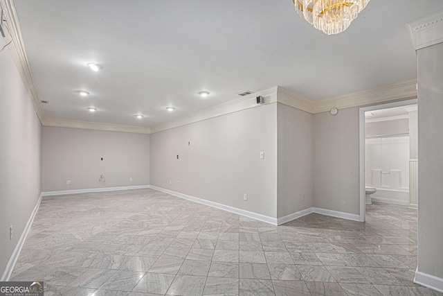 empty room featuring baseboards, marble finish floor, an inviting chandelier, and crown molding