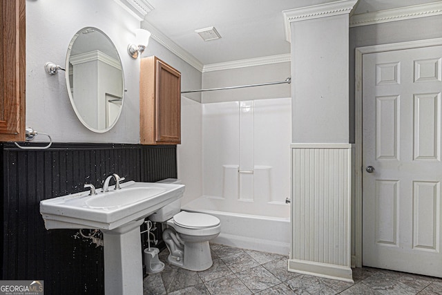 full bath featuring visible vents, crown molding, a wainscoted wall, toilet, and shower / bathing tub combination