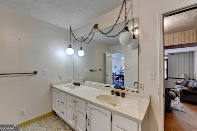 bathroom featuring vanity and a textured ceiling