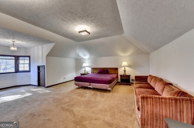 carpeted bedroom featuring a textured ceiling, a chandelier, and lofted ceiling