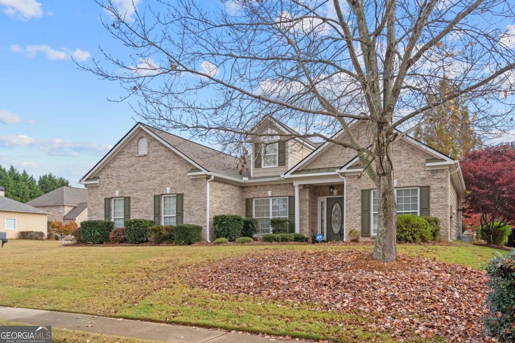 front facade with a front lawn