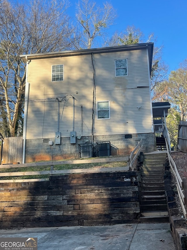 back of property with central air condition unit