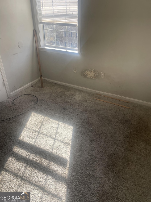 empty room with carpet flooring