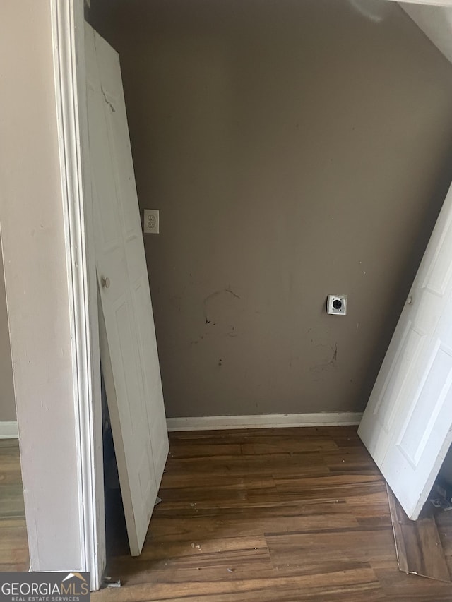 interior space featuring electric dryer hookup and dark hardwood / wood-style floors