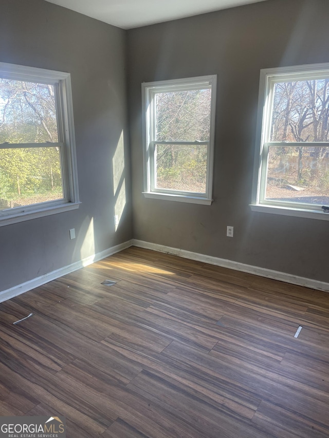 empty room featuring dark hardwood / wood-style floors