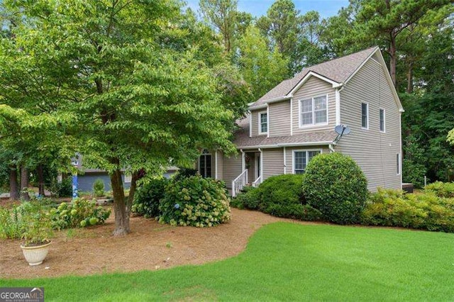 view of front of home with a front yard