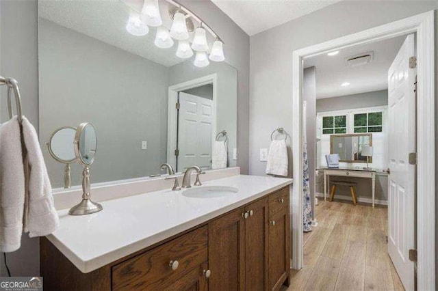 bathroom featuring vanity and wood-type flooring