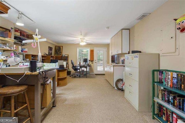 kitchen featuring ceiling fan, french doors, electric panel, track lighting, and light carpet