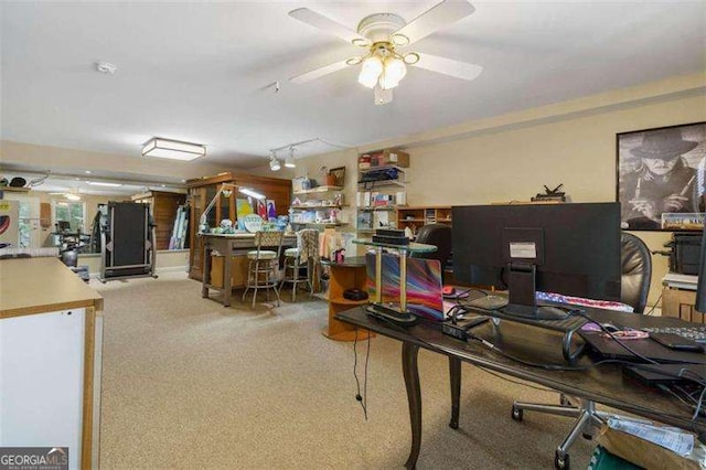 office space with ceiling fan, carpet floors, and rail lighting