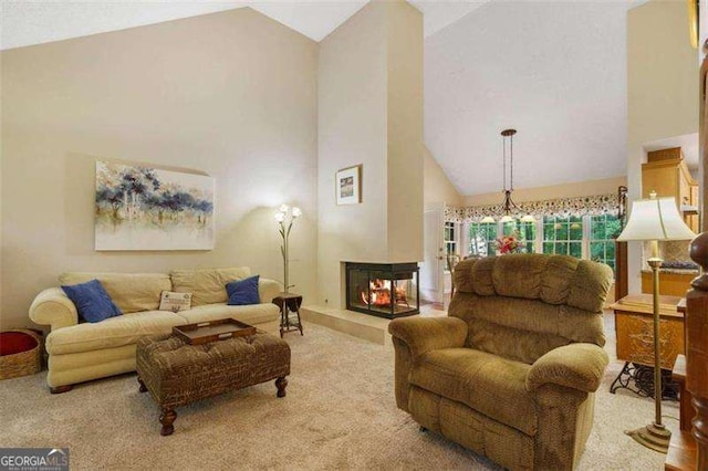 carpeted living room featuring a multi sided fireplace and high vaulted ceiling