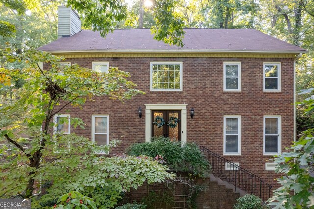 colonial inspired home with french doors