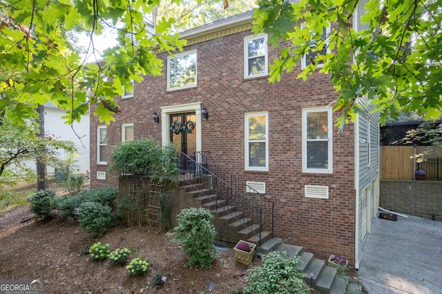 colonial home with a garage