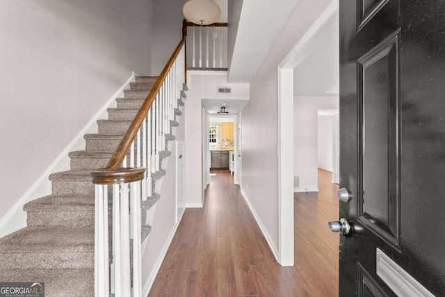 entryway with hardwood / wood-style floors