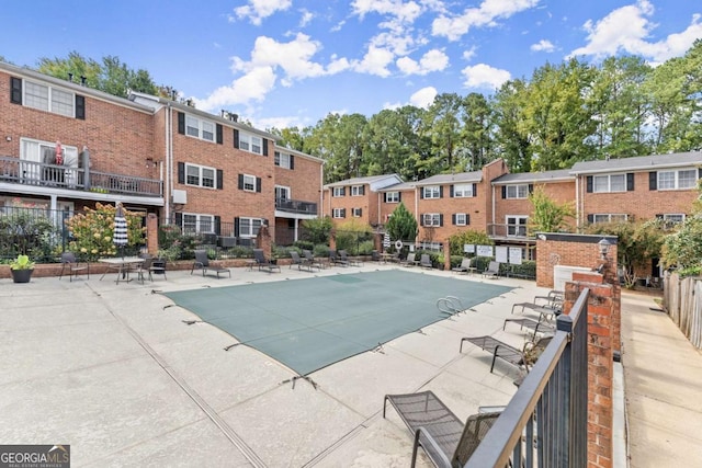 view of swimming pool featuring a patio